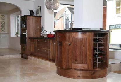 Round Peninsular Unit in Solid Black Walnut.